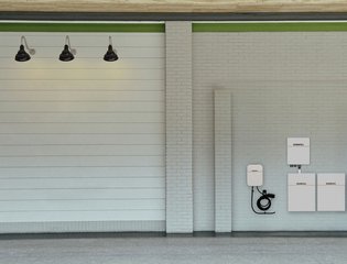 Dura5 solar battery and Dura-i hybrid inverter on a garage wall