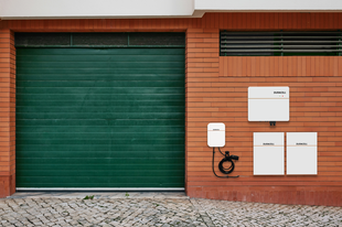 Solar battery and home storage products installed on a brick wall