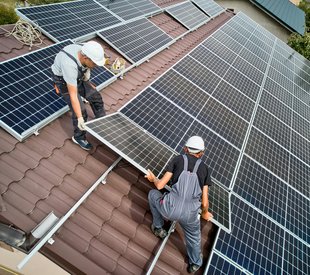 Solar Panels being installed on a roof