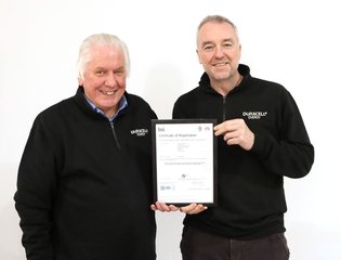 Phil Warner and Mark Millar with the ISO certification