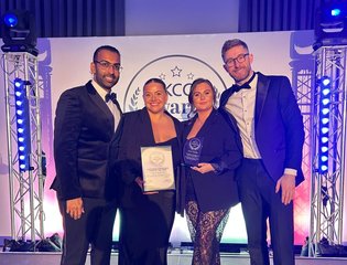 Puredrive Energy customer service team celebrating on stage